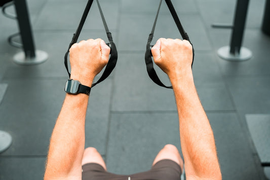 A man is doing a pull up exercise