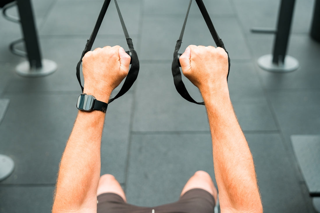 A man is doing a pull up exercise